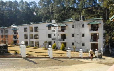 Wider view of a row of modern apartment buildings in the complex